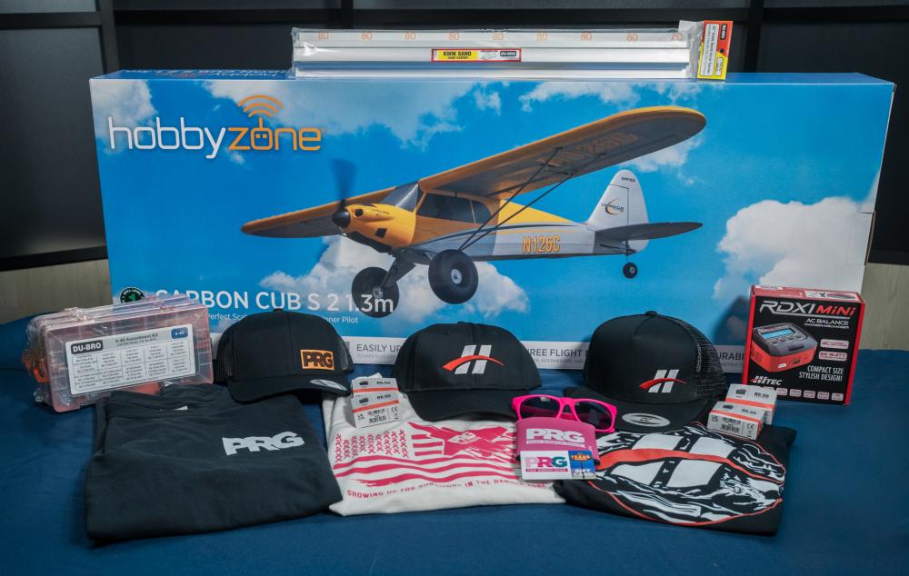 HobbyZone RC airplane box with branded merchandise and accessories.