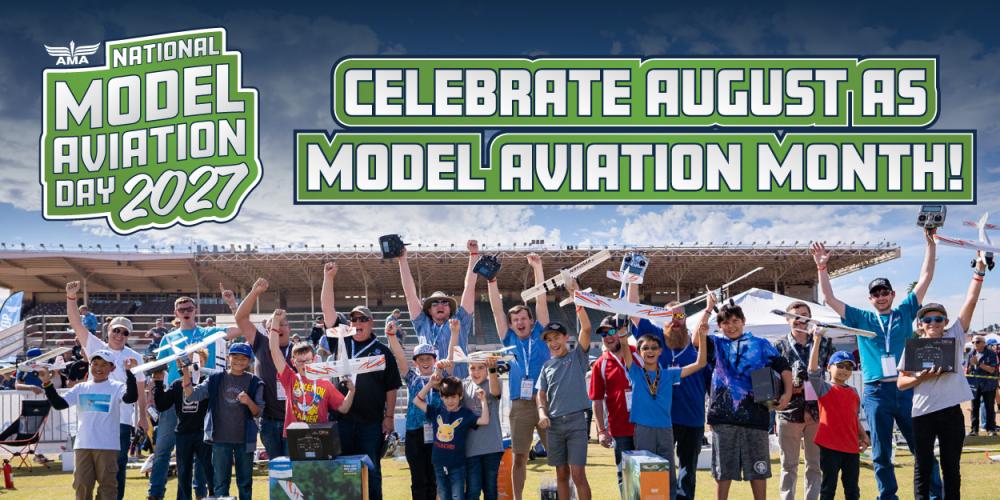 Crowd celebrating with model planes outdoors.