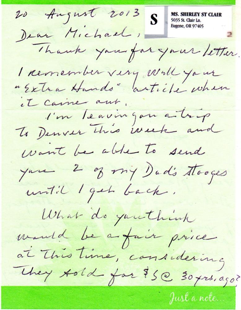 Handwritten letter on a green background with a printed address label.