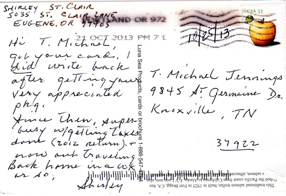 Postcard with handwritten message and stamp featuring an apple.