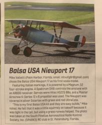Model aircraft with Italian markings on grass runway.