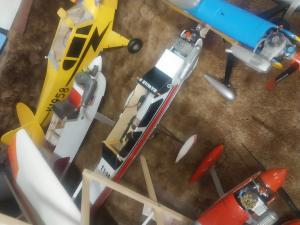 Toy airplanes on display, including a yellow model with propellers.